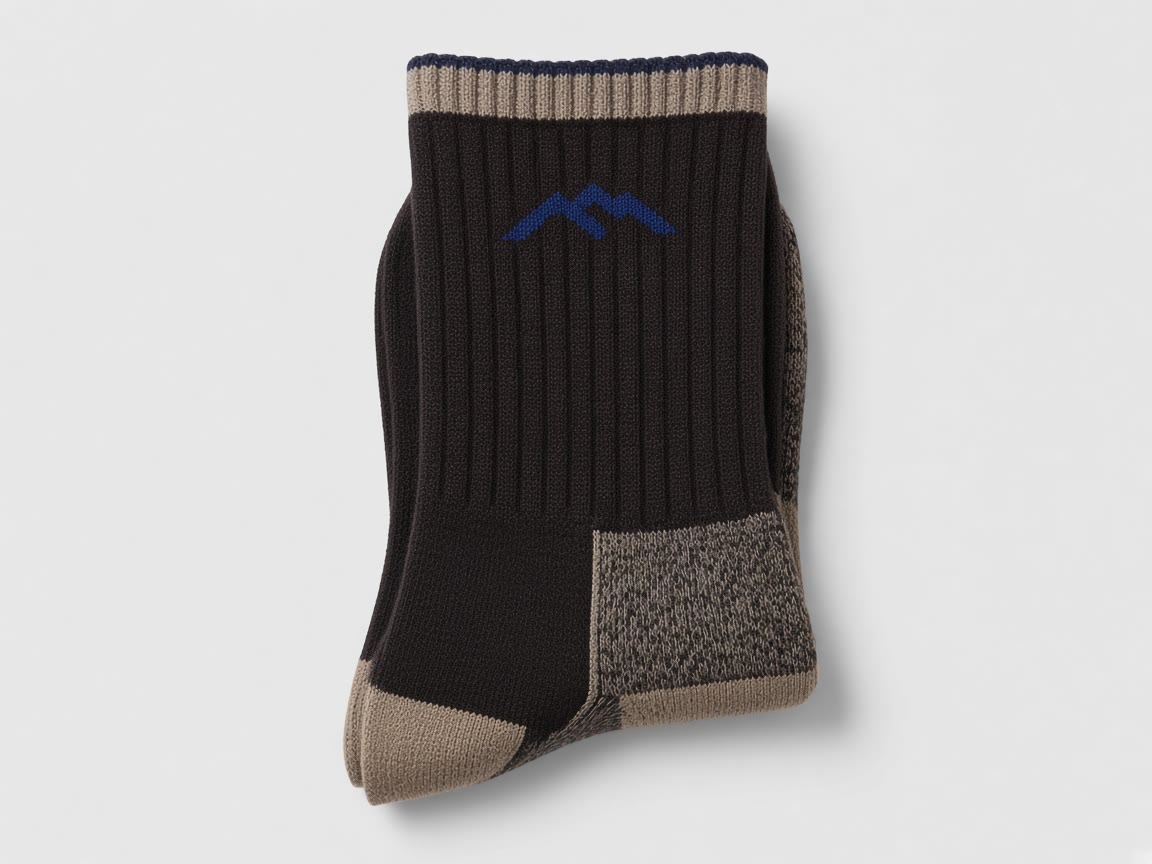 Pair of merino hiking socks on a plain background.