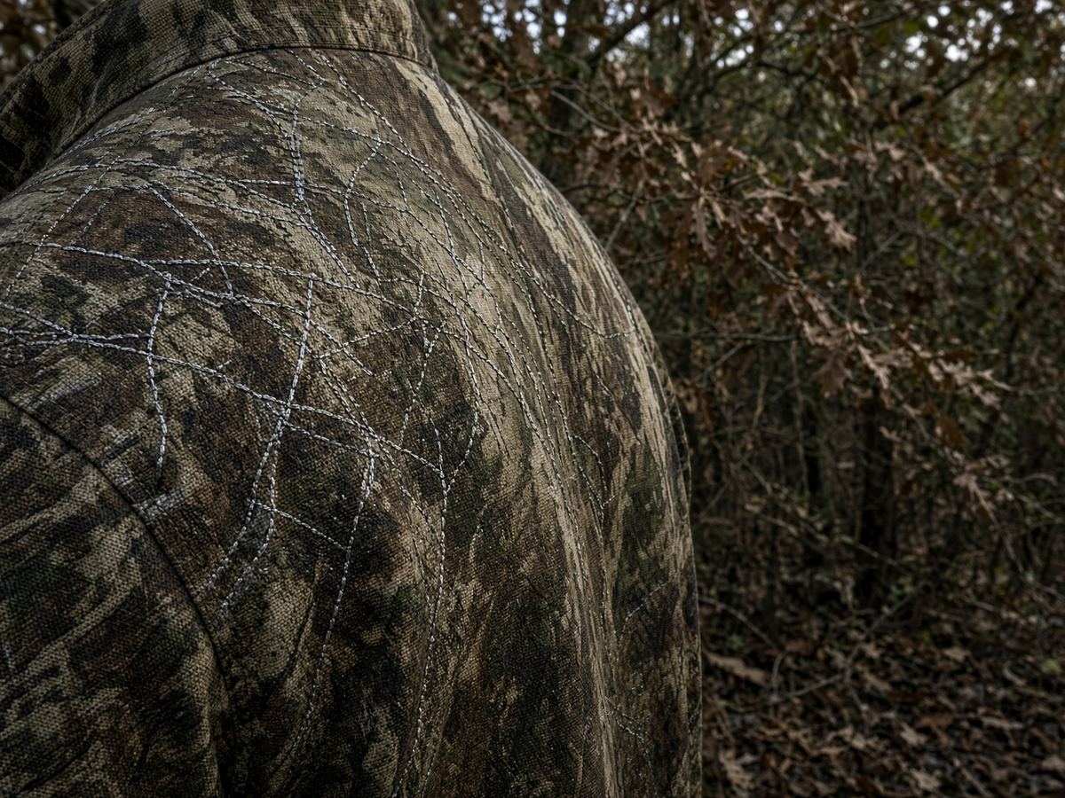 Stillness and wind beat a conductive grid. The suit is clothing.