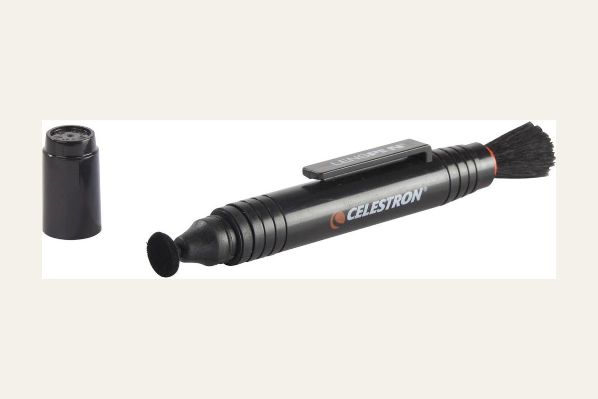 Celestron LensPen optics cleaning tool with a retractable brush, no firearm.
