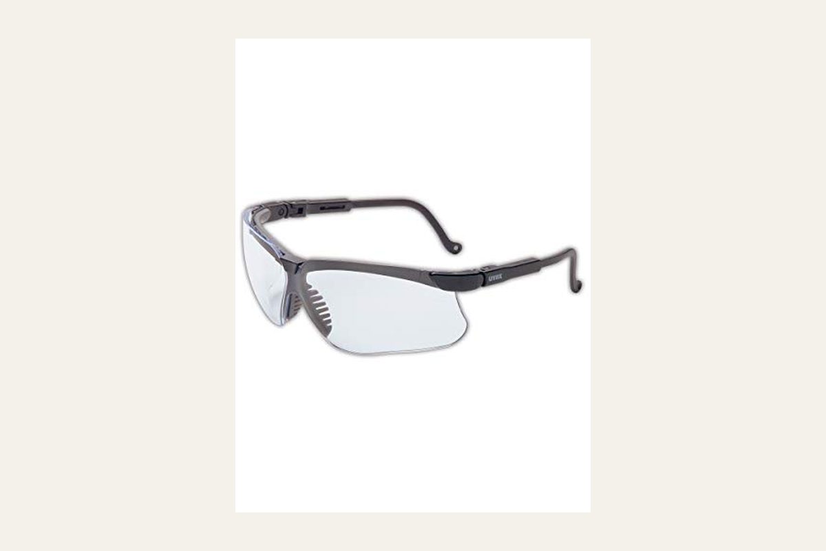 Uvex Genesis S3200X safety glasses, black frame, clear lens, with no firearm.