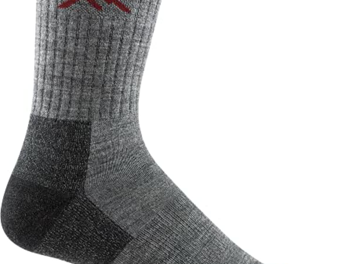 A merino micro-crew in a trail shoe. The sock is half the Speedcross story. Cotton is a blister.