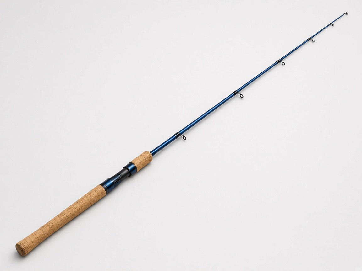 A spinning rod with a cork handle on a plain background