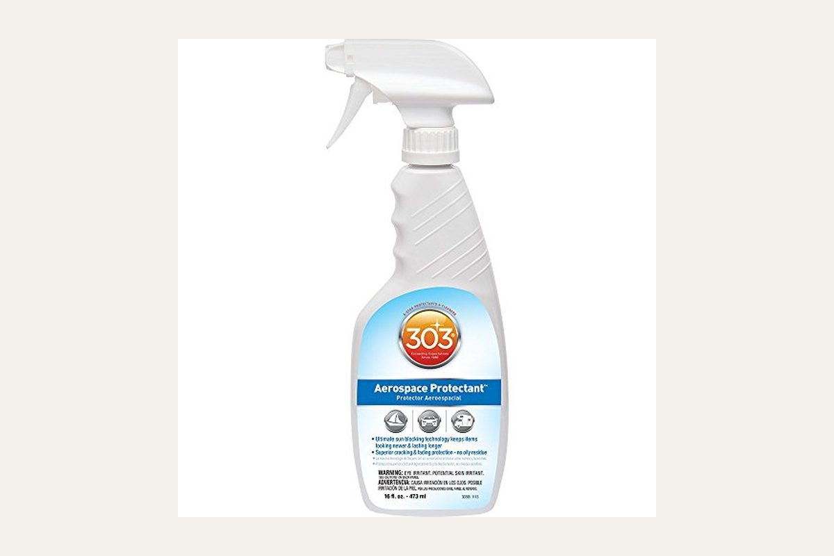 303 Marine Aerospace Protectant bottle, model 30306, 32 ounces, on a boat seat with no people.