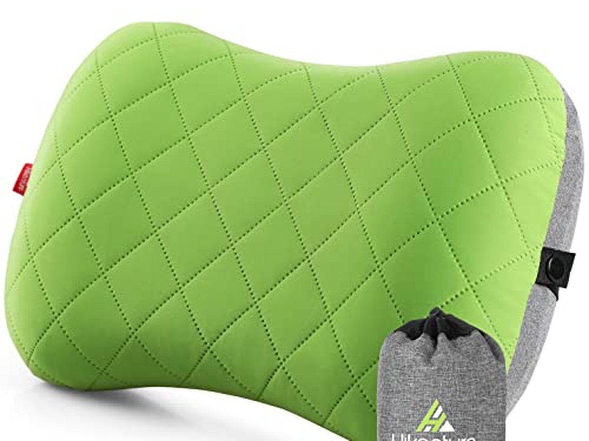 An inflatable pillow on a foam pad in a tent. The valve is the night.