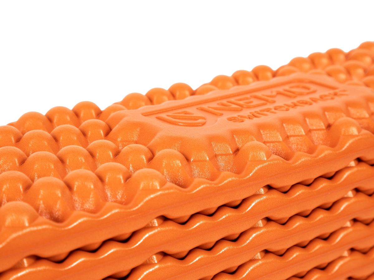 NEMO Switchback closed-cell foam sleeping pad, accordion folded, egg-crate face.
